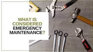 what is concidered an emergency maiontenance text with wrenches and otehr tools on a wood table 