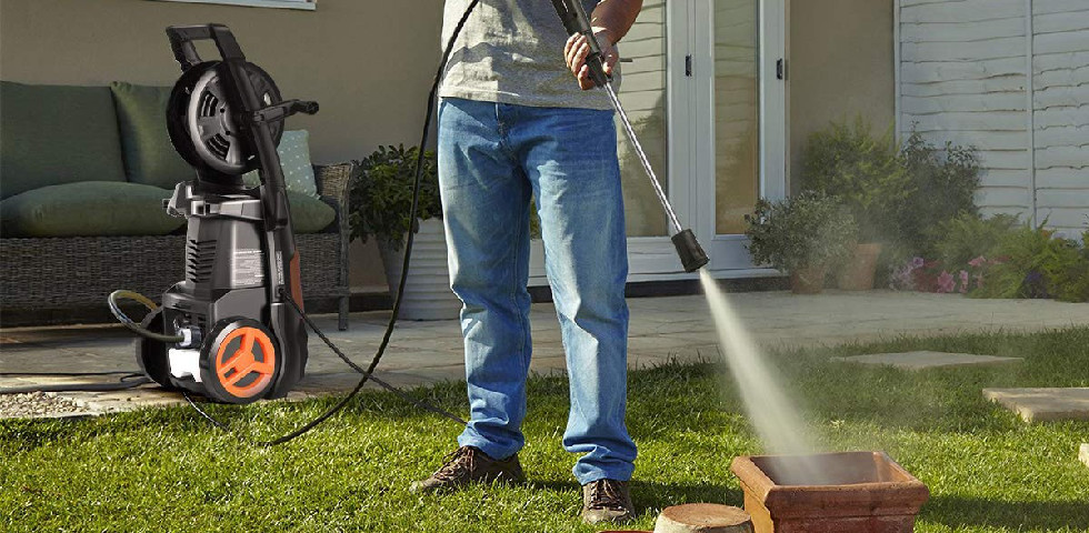 Pit Pro Handyman using an electric corded power washer to clean garden elements in cranberry township Pennsylvania 