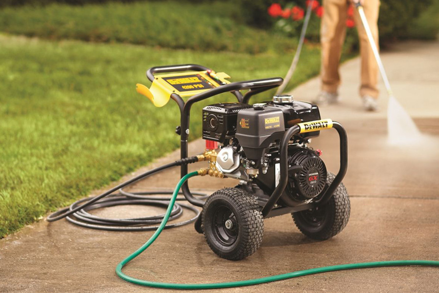 Cleaning a sidewalk with a gas poered power washer on concrete sidewalk dewalt power washer