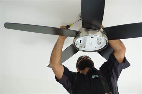 A Pit Pro Handyman installing a new ceiling fan for a Cranberry township client. 