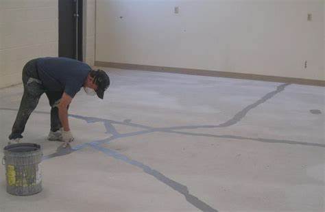Pittsburgh handyman repairing several cracks in a pittsburgh garage floor